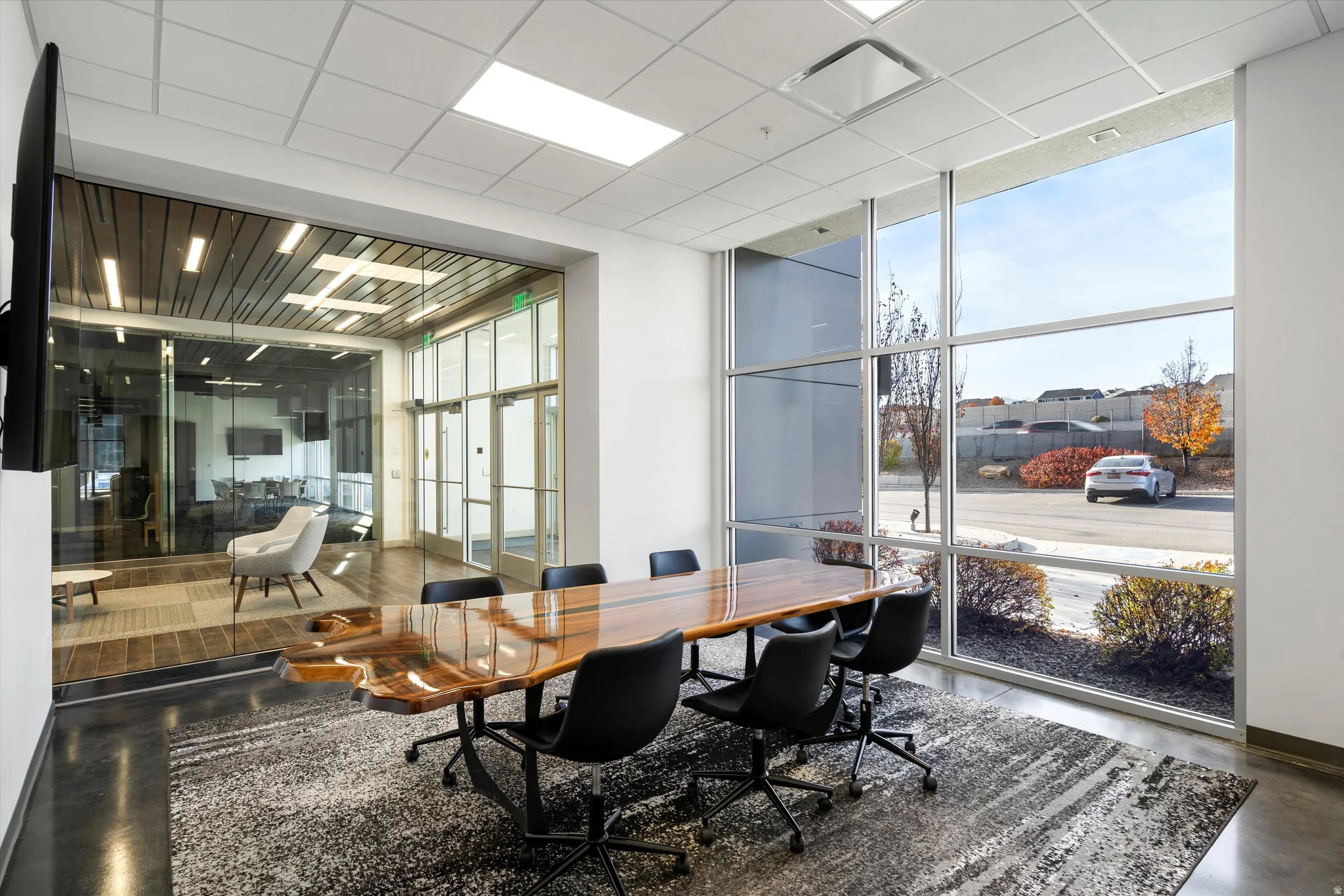 Conference room with expansive windows and a paneled ceiling