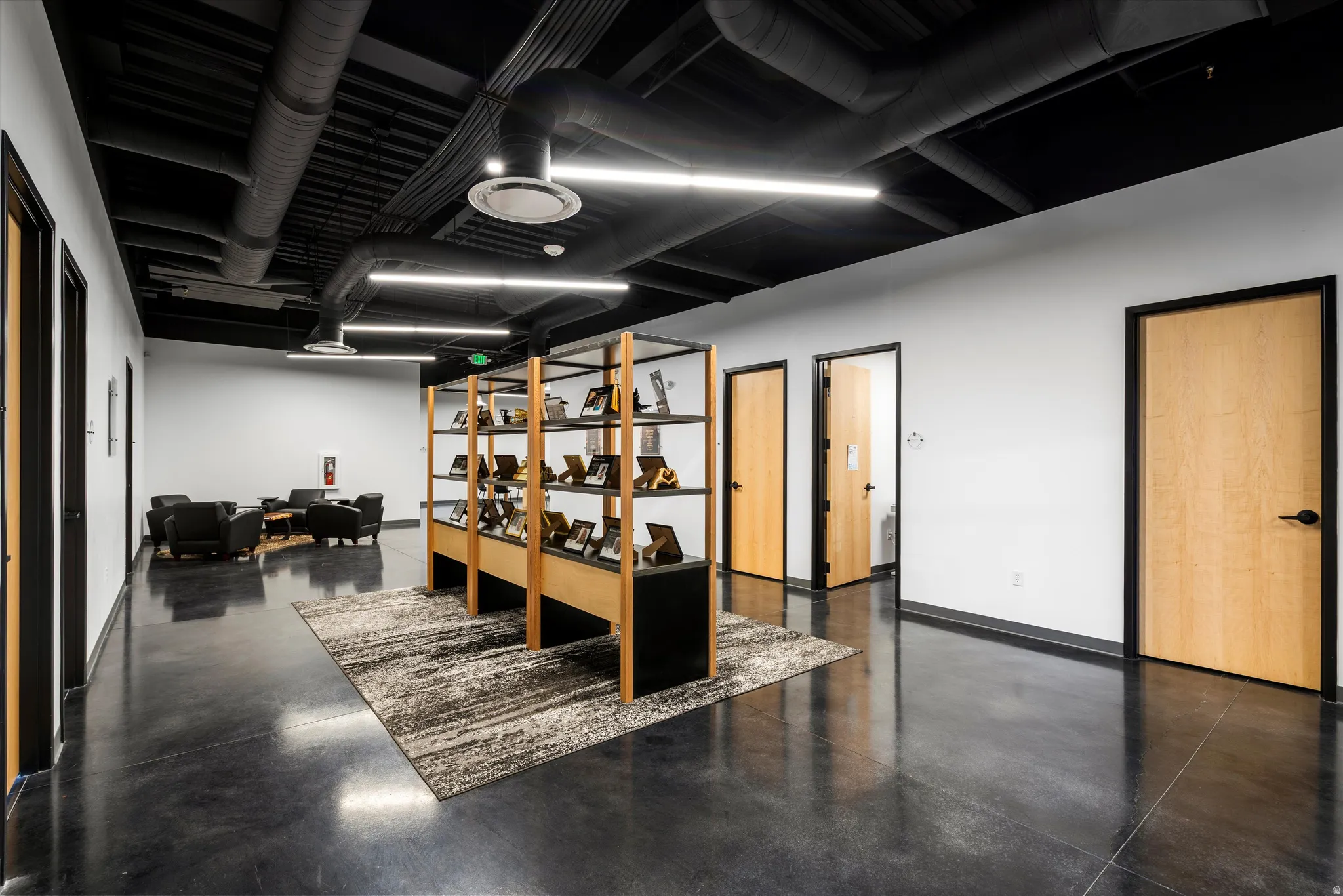 Office with concrete flooring and baseboards