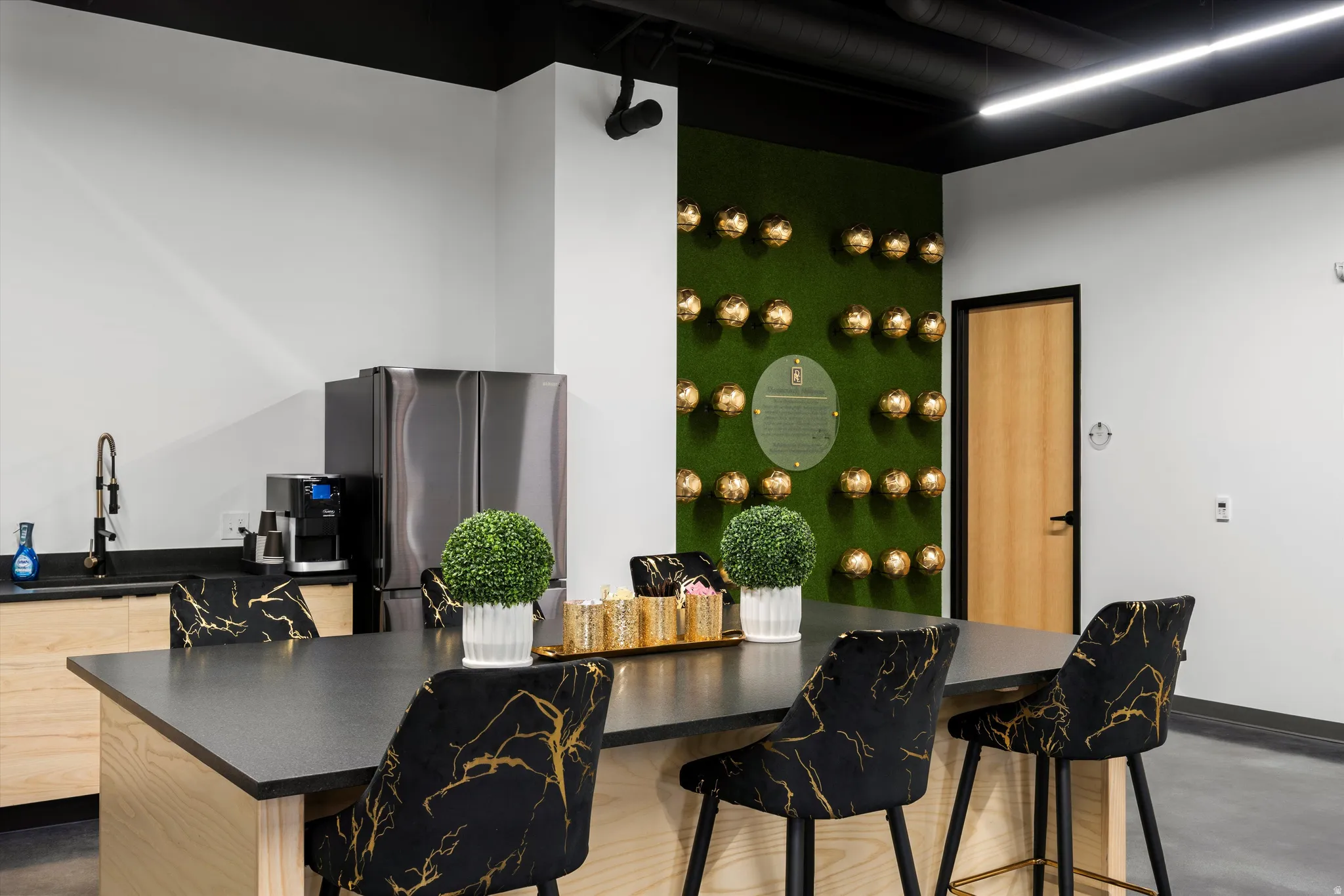 Dining space with finished concrete floors and granite counter tops