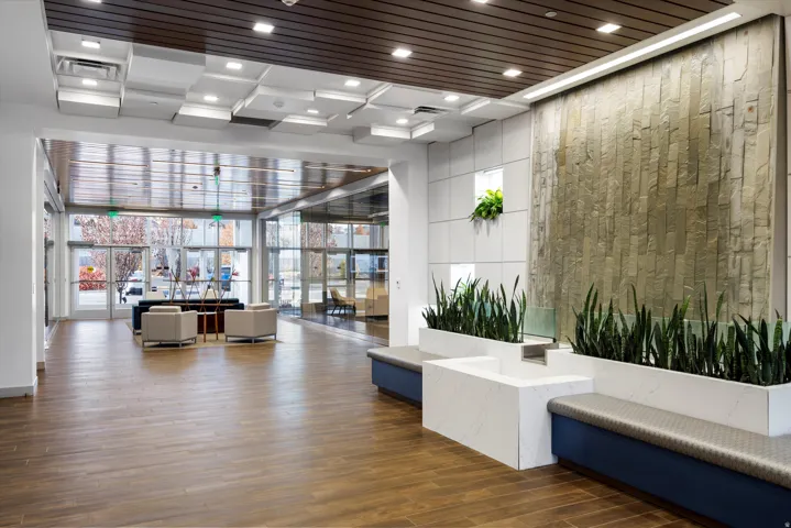 Building lobby featuring floor to ceiling windows and recessed lighting