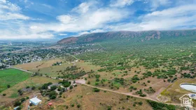 Aerial view of sparsely populated area featuring a mountainous background