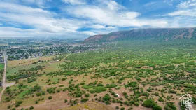 Aerial view of sparsely populated area with a mountain backdrop