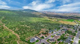 Aerial overview of property's location featuring a mountain backdrop