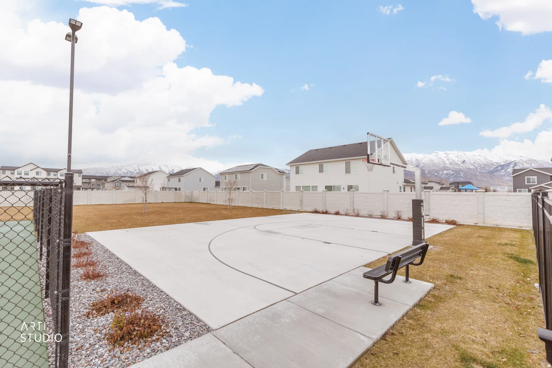 View of basketball court with community basketball court, a residential view, and a fenced backyard