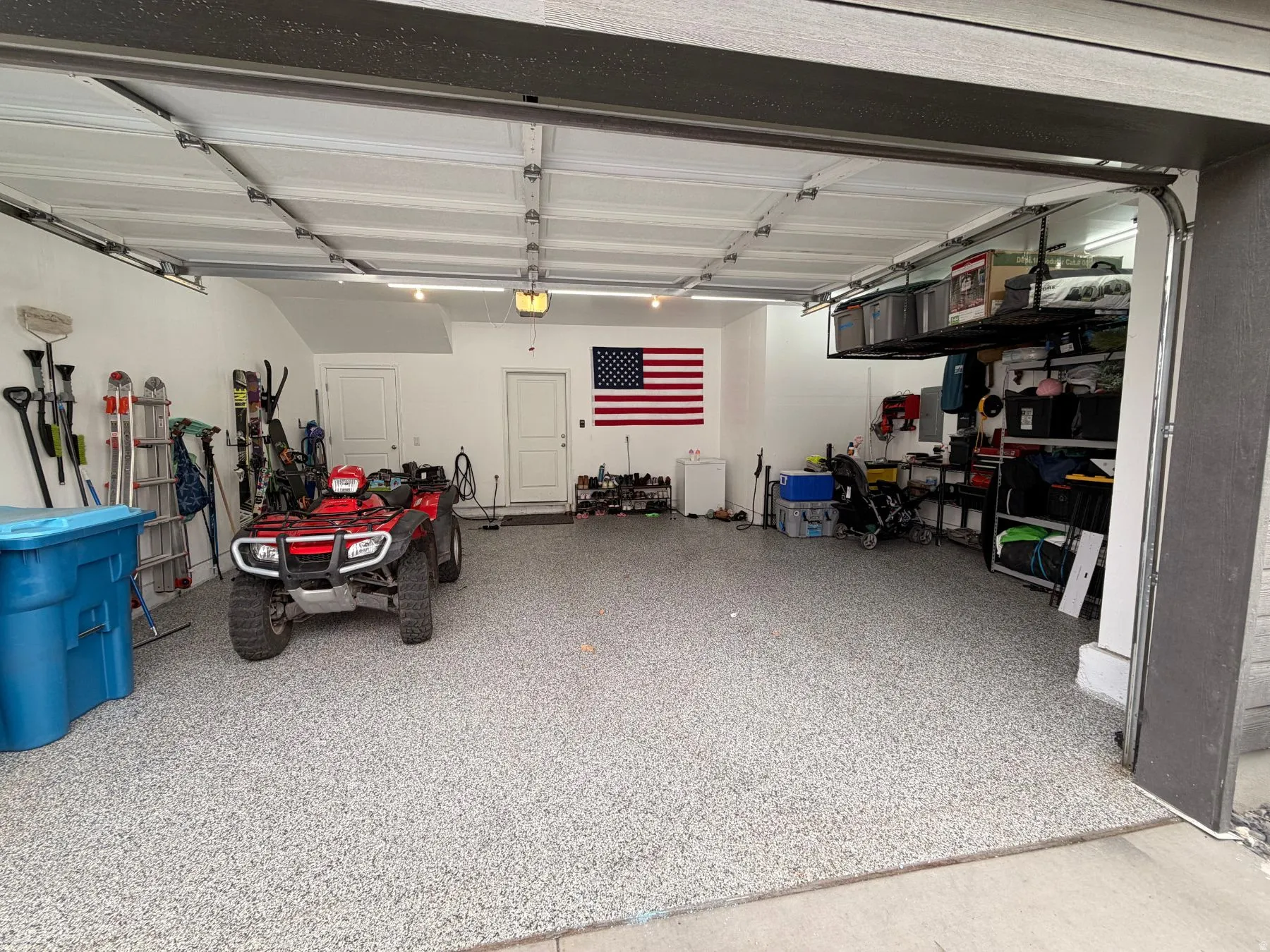 Garage featuring a garage door opener