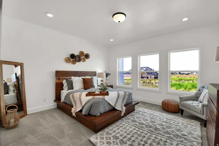 Carpeted bedroom with baseboards and recessed lighting