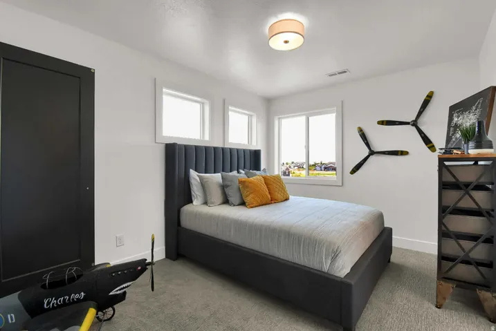 Carpeted bedroom with baseboards
