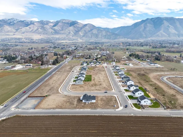 Aerial perspective of suburban area featuring a mountainous background
