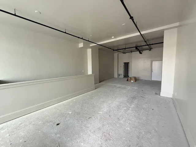 Garage featuring baseboards