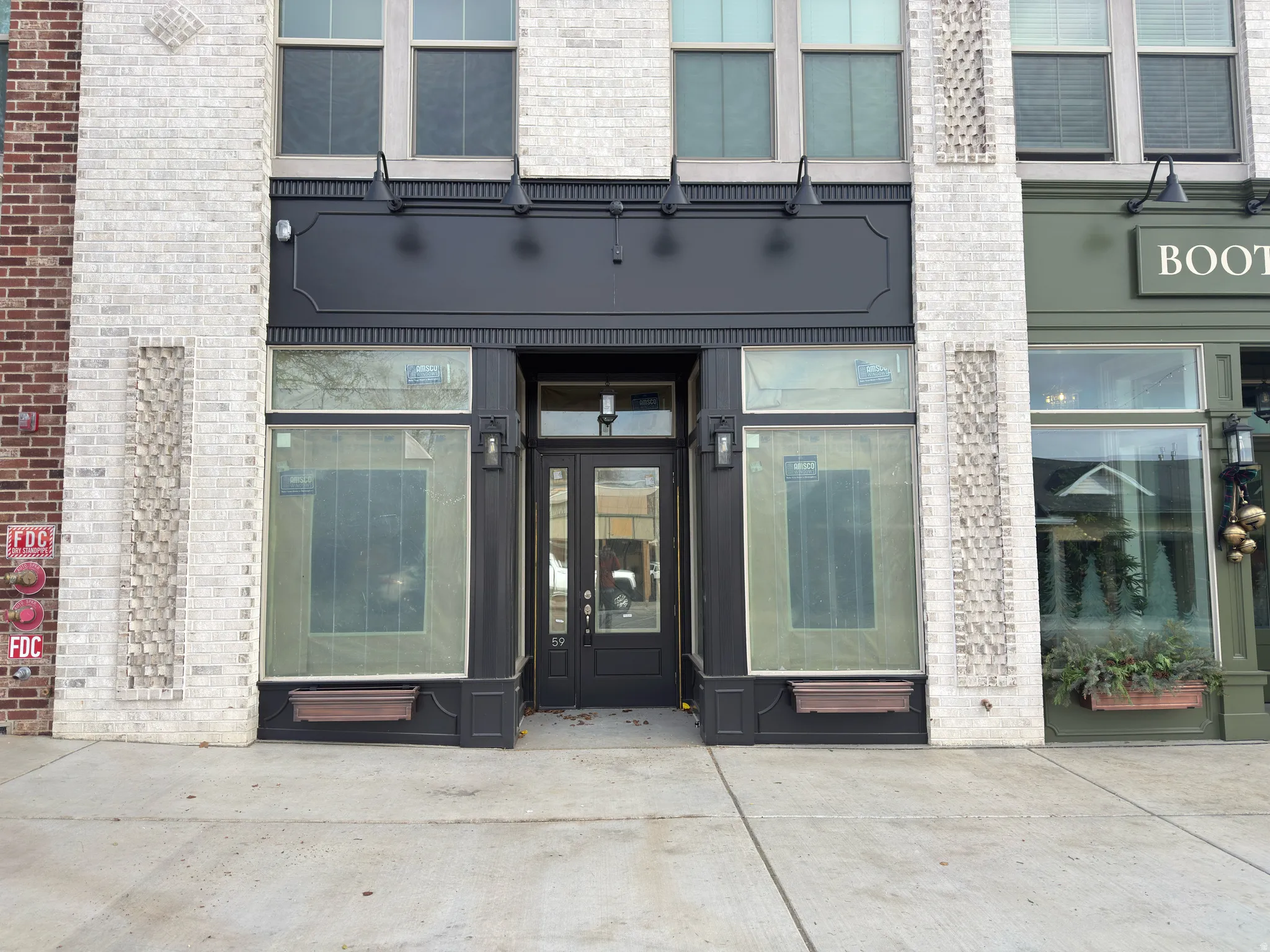 View of exterior entry with brick siding