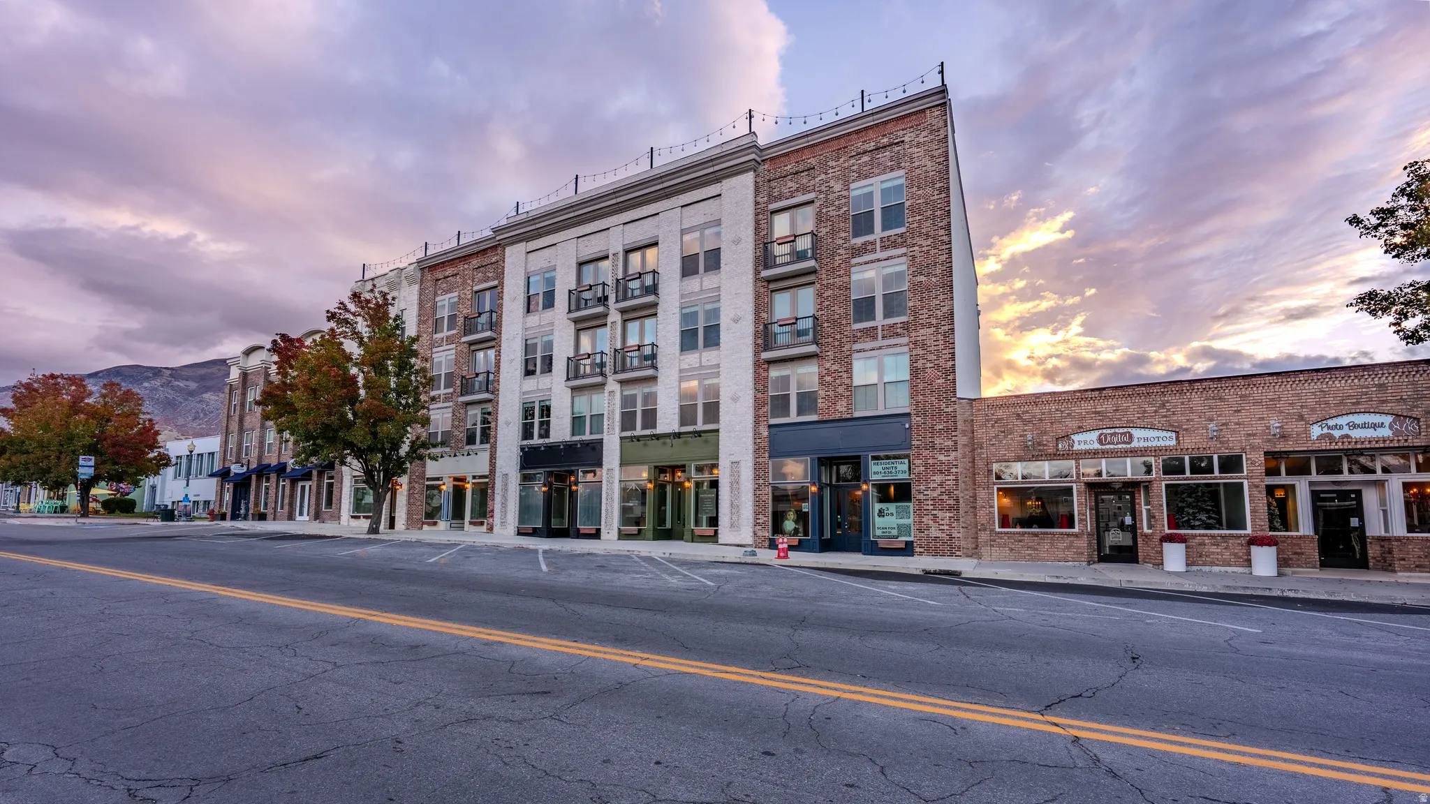 View of property featuring uncovered parking