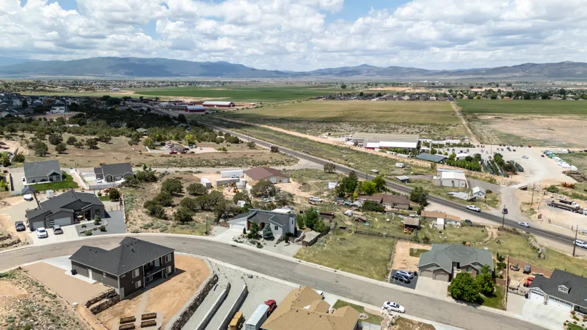 Aerial view of residential area featuring mountains