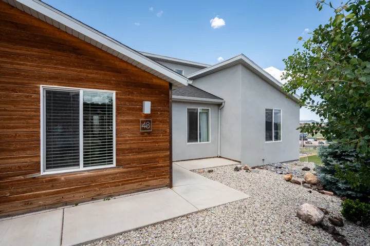 Entrance to property featuring stucco siding