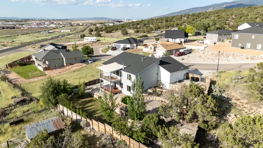 Aerial view of residential area featuring a mountainous background