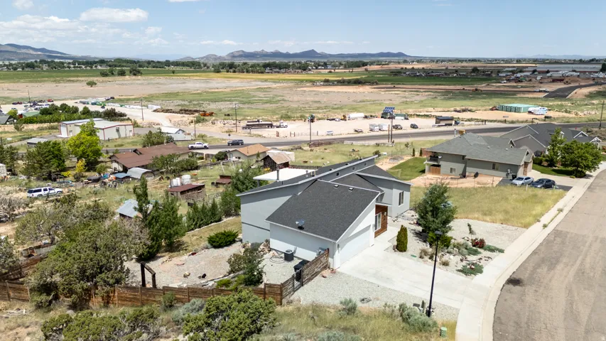 Aerial perspective of suburban area featuring a mountainous background