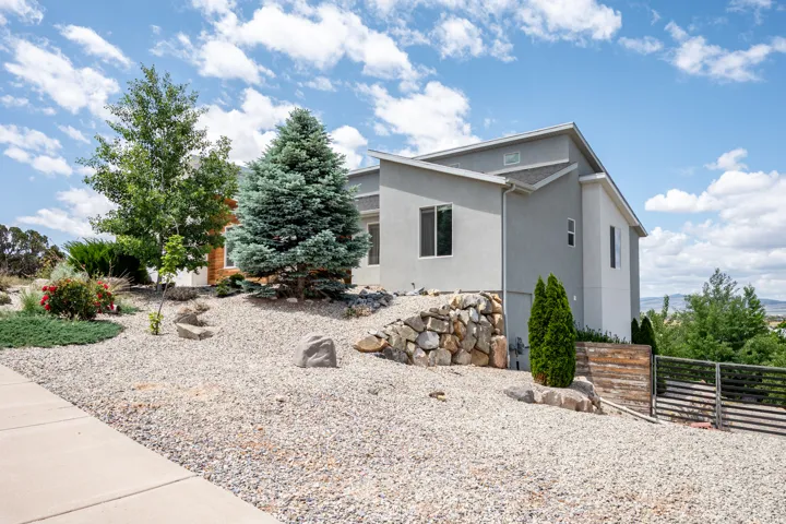 View of side of home featuring stucco siding