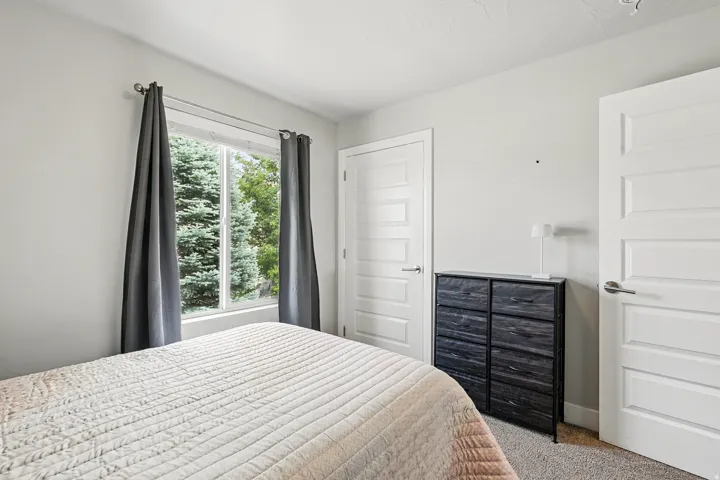 Bedroom featuring carpet floors and a closet