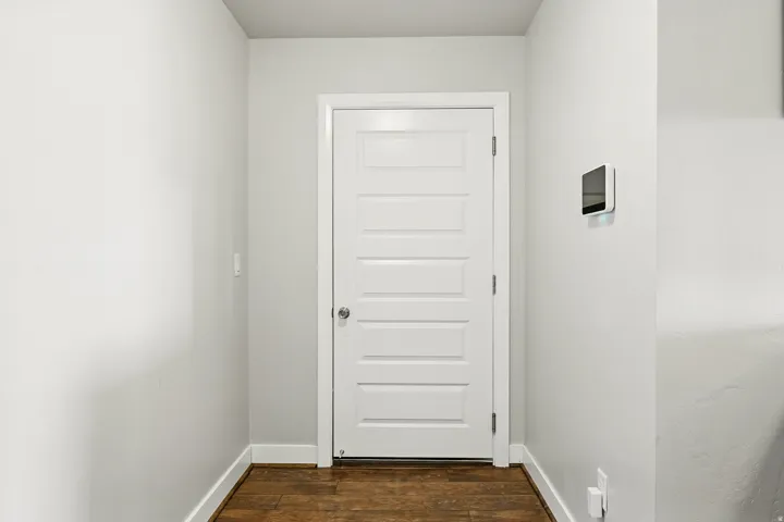 Entryway featuring wood finished floors and baseboards