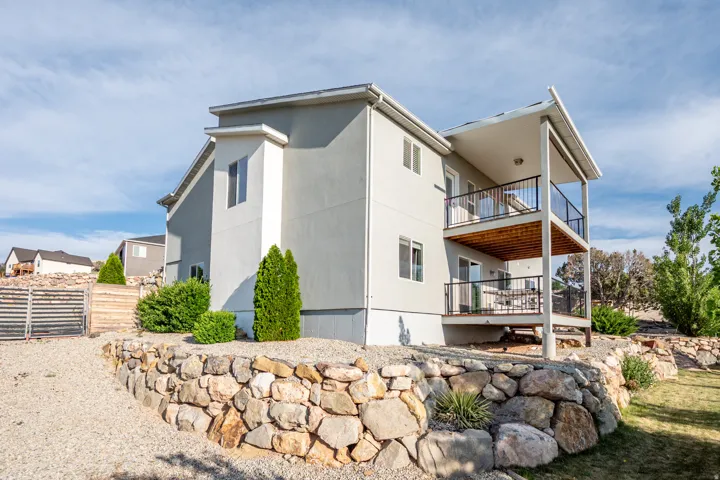 View of home's exterior featuring a balcony