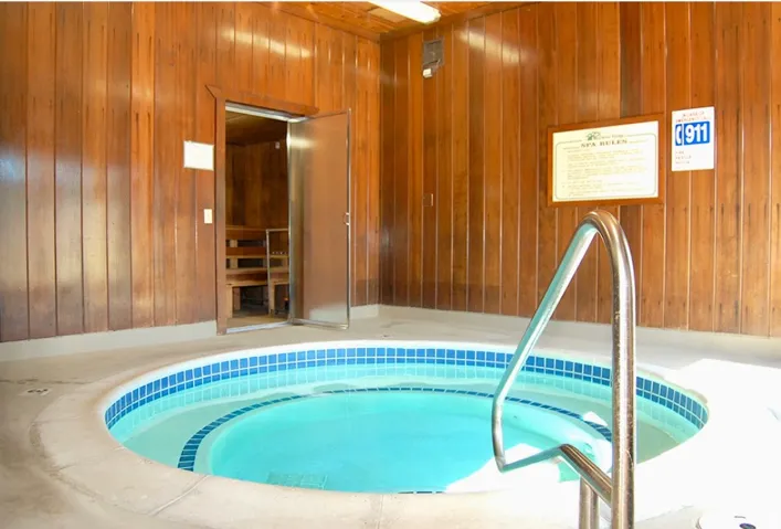 View of pool featuring an in-ground hot tub