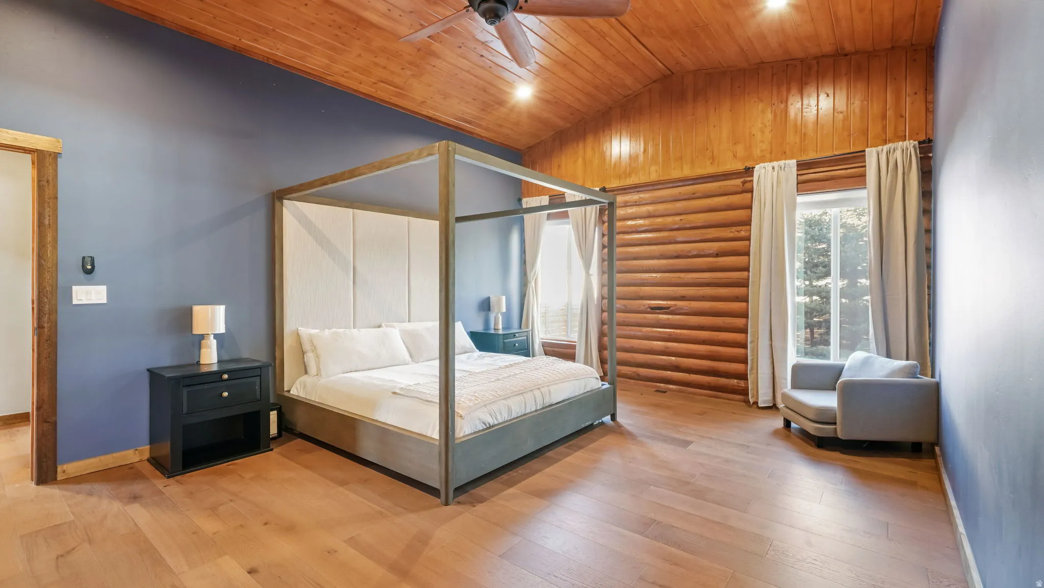 Primary Bedroom with lofted ceiling, wood ceiling, a ceiling fan, and large ensuite bath with huge walk-in closet