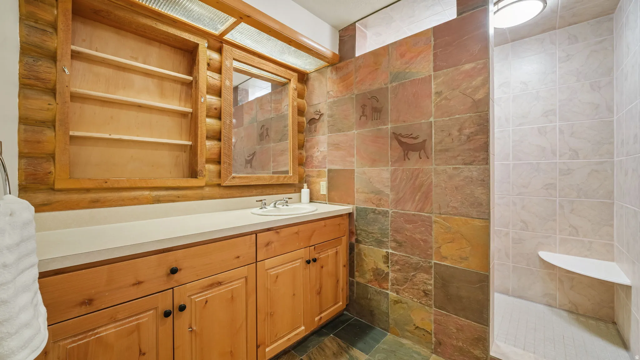 Jack and jill ensuite bathroom located next to the 2nd main level bedroom