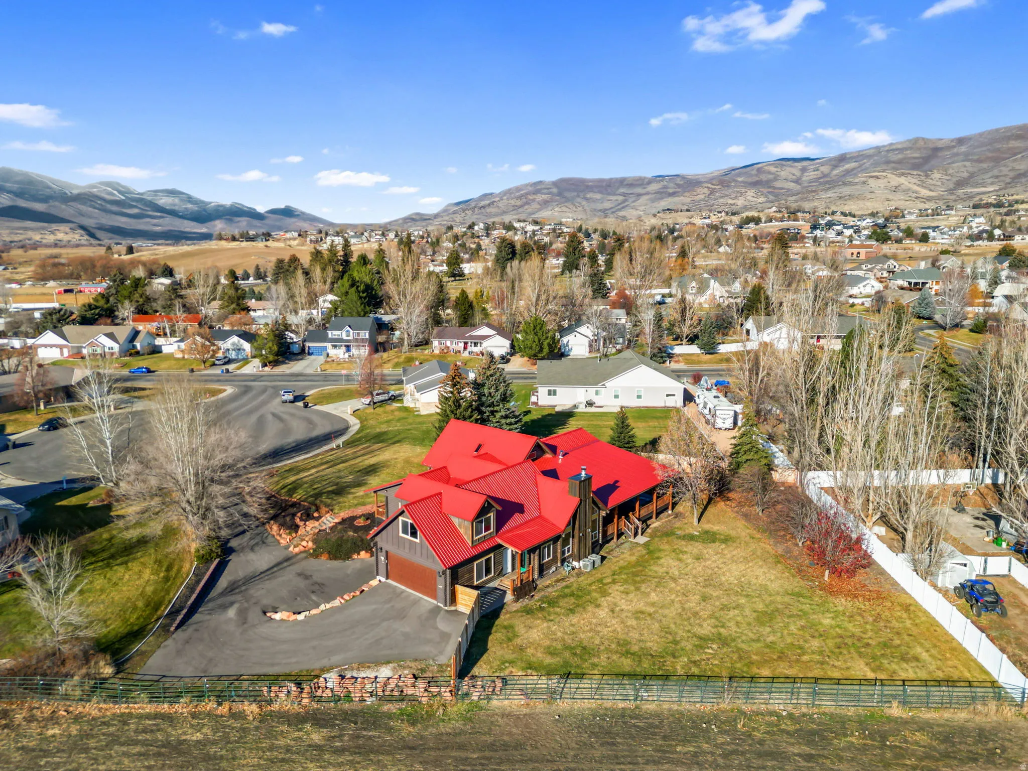 Aerial perspective of suburban area featuring a mountain backdrop