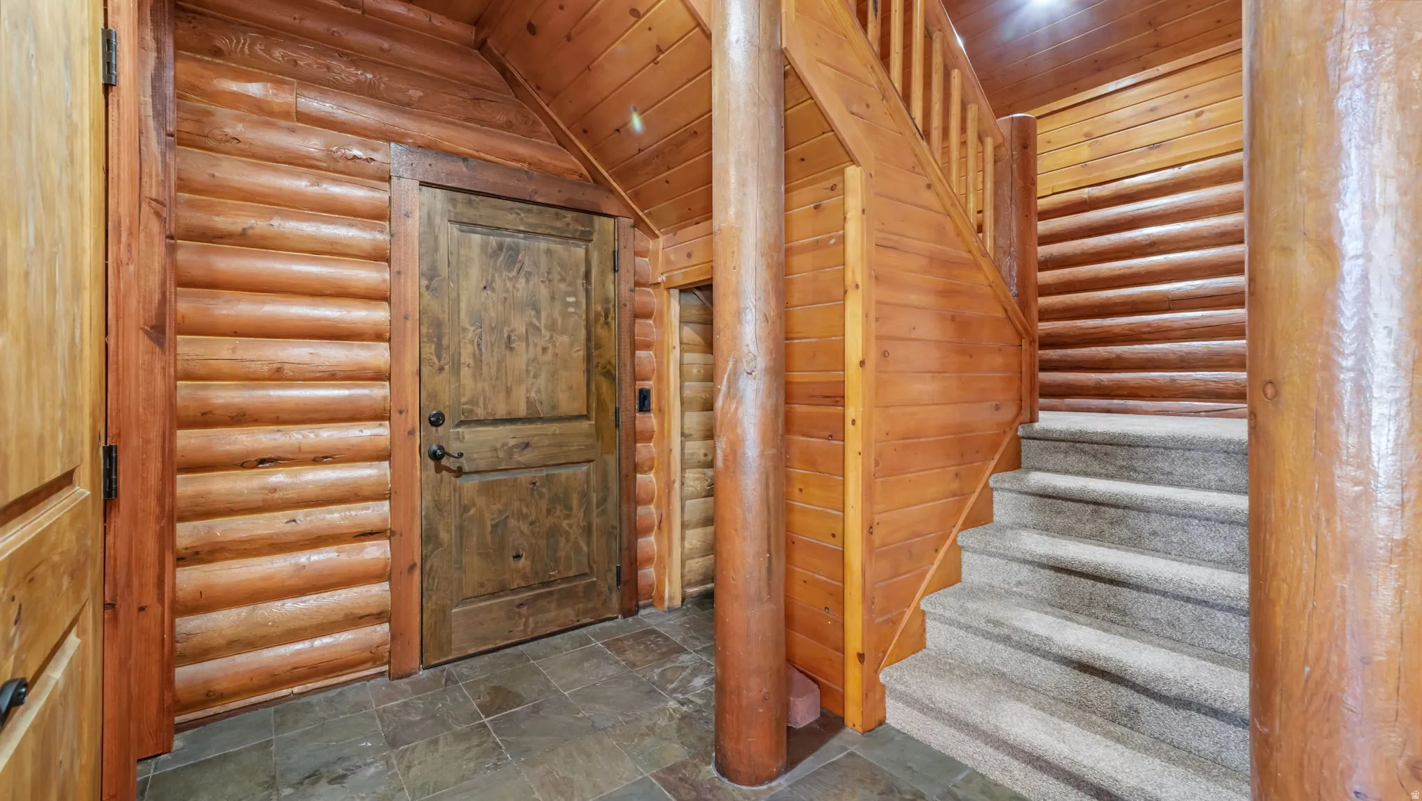 Entrance from the main level garage with laundry room through the left door