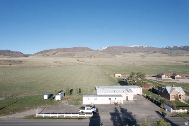 Aerial view of sparsely populated area featuring a mountain backdrop