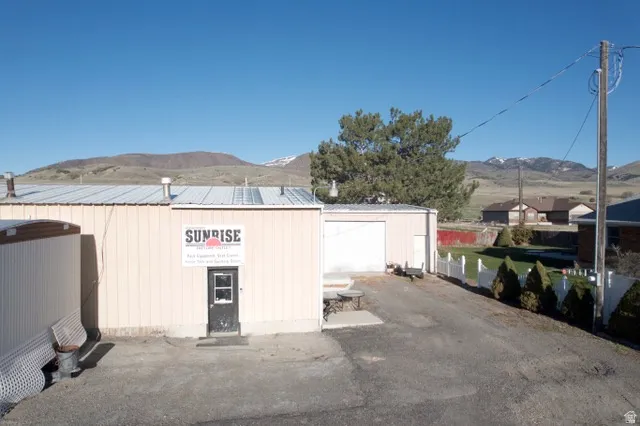 Garage with a mountain view and driveway