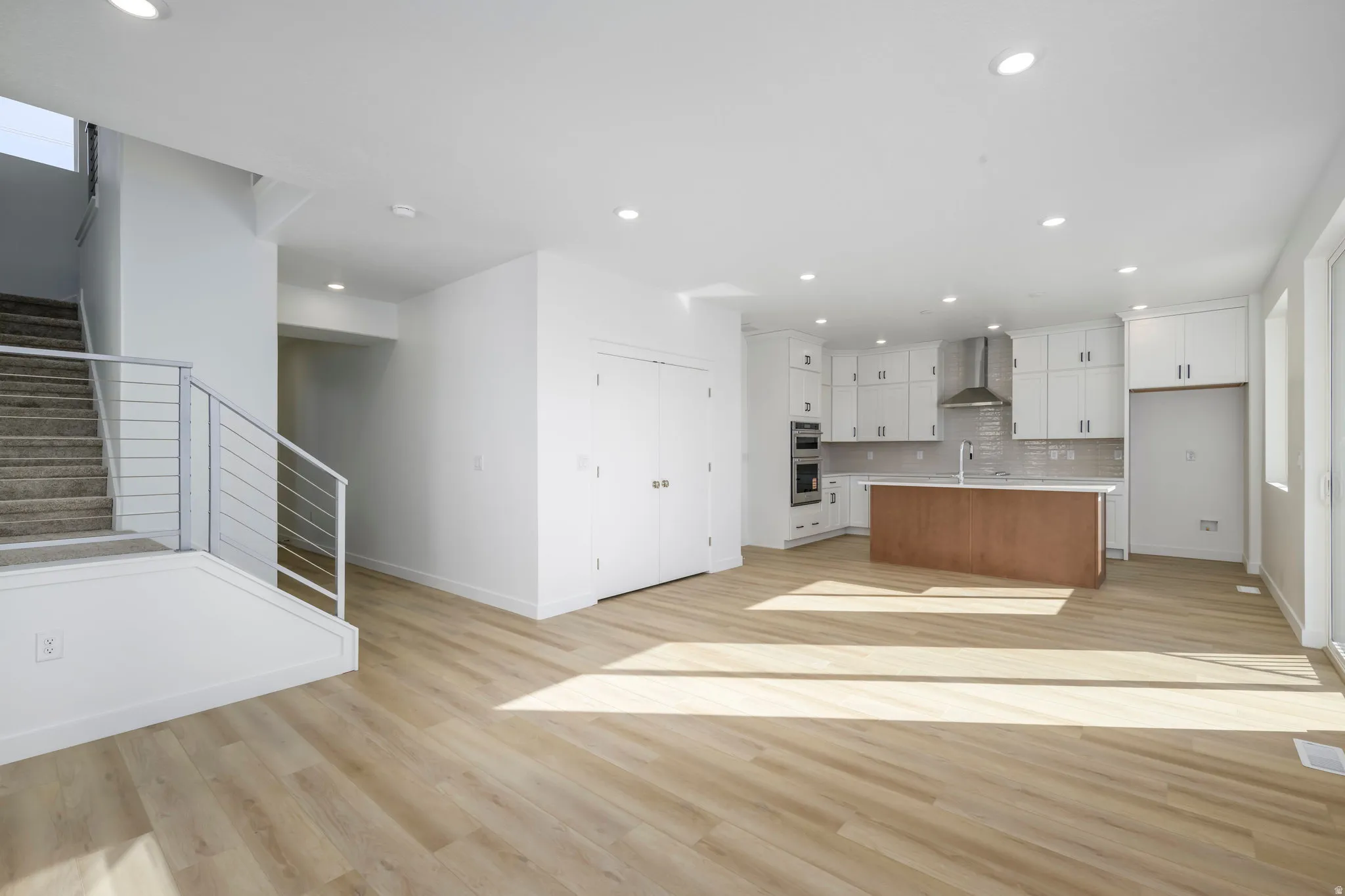 A total 'wow' kitchen-quartz countertops, stainless appliances, and a big island for charcuterie or homework.