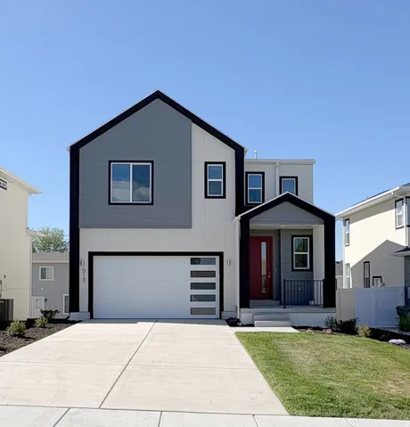 Contemporary house with an attached garage, concrete driveway, a front lawn, and covered porch