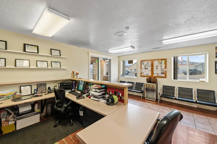 Office area featuring a textured ceiling