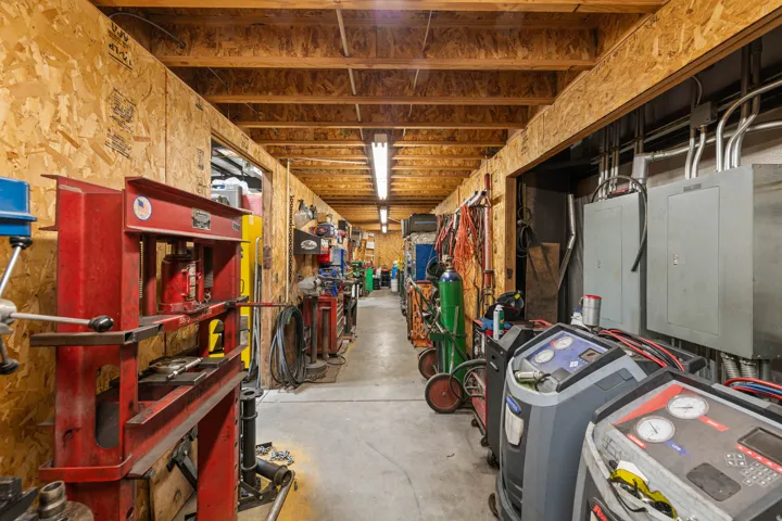 Basement with electric panel and washer / clothes dryer