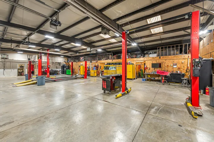Garage with a workshop area and a garage door opener