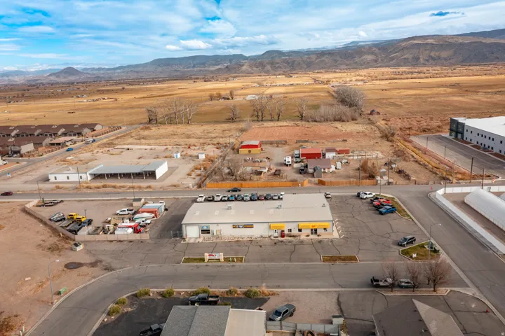 Drone / aerial view of mountains and industrial structures