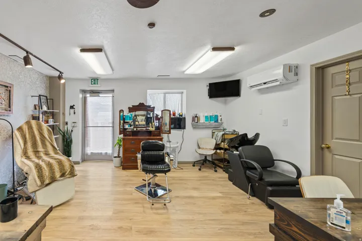 Misc room with a textured ceiling and a wall mounted air conditioner