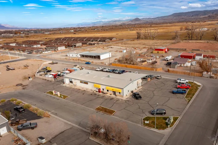 Bird's eye view of a mountainous background and industrial structures