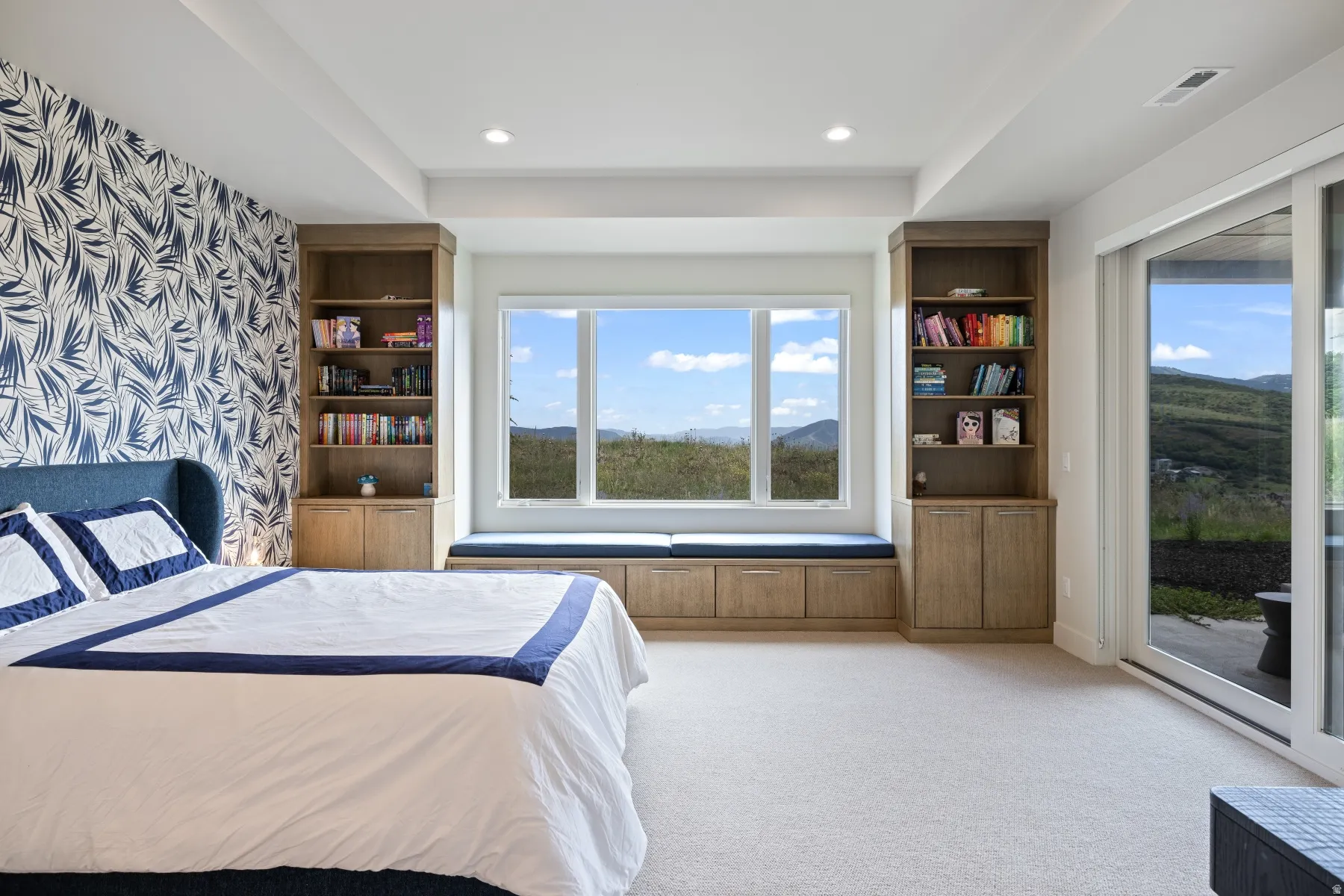 Bedroom with access to outside, light carpet, and recessed lighting