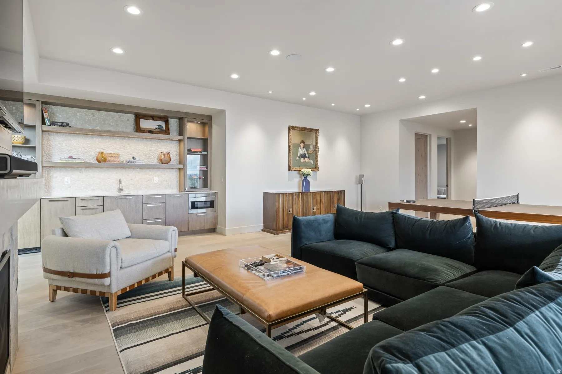 Living room with recessed lighting and light wood-type flooring