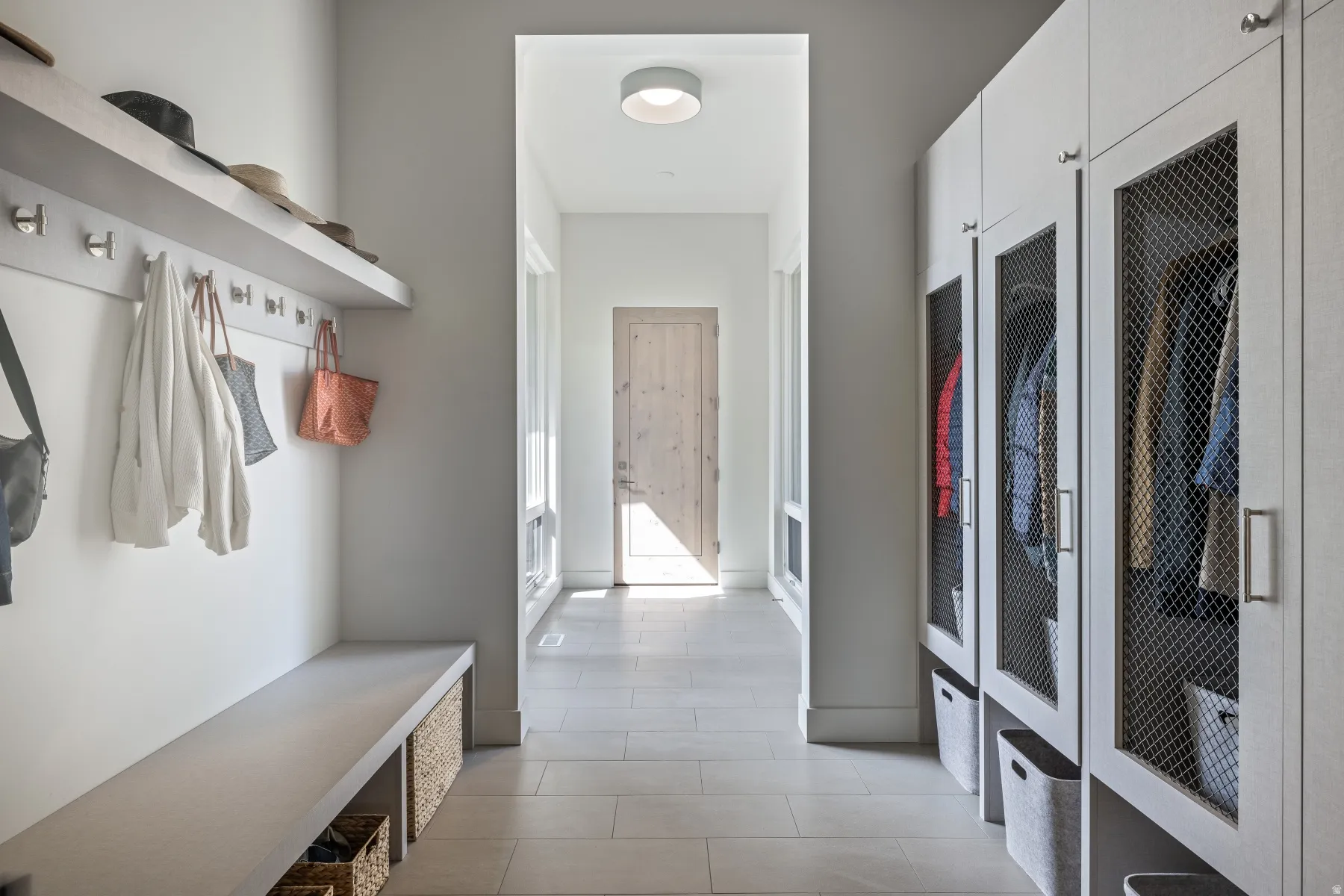 Mudroom featuring light tile patterned floors