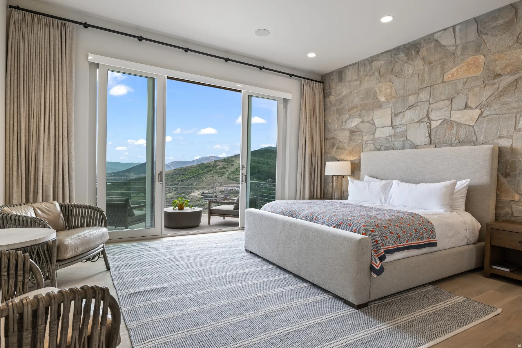 Bedroom featuring a mountain view, access to outside, wood finished floors, and recessed lighting