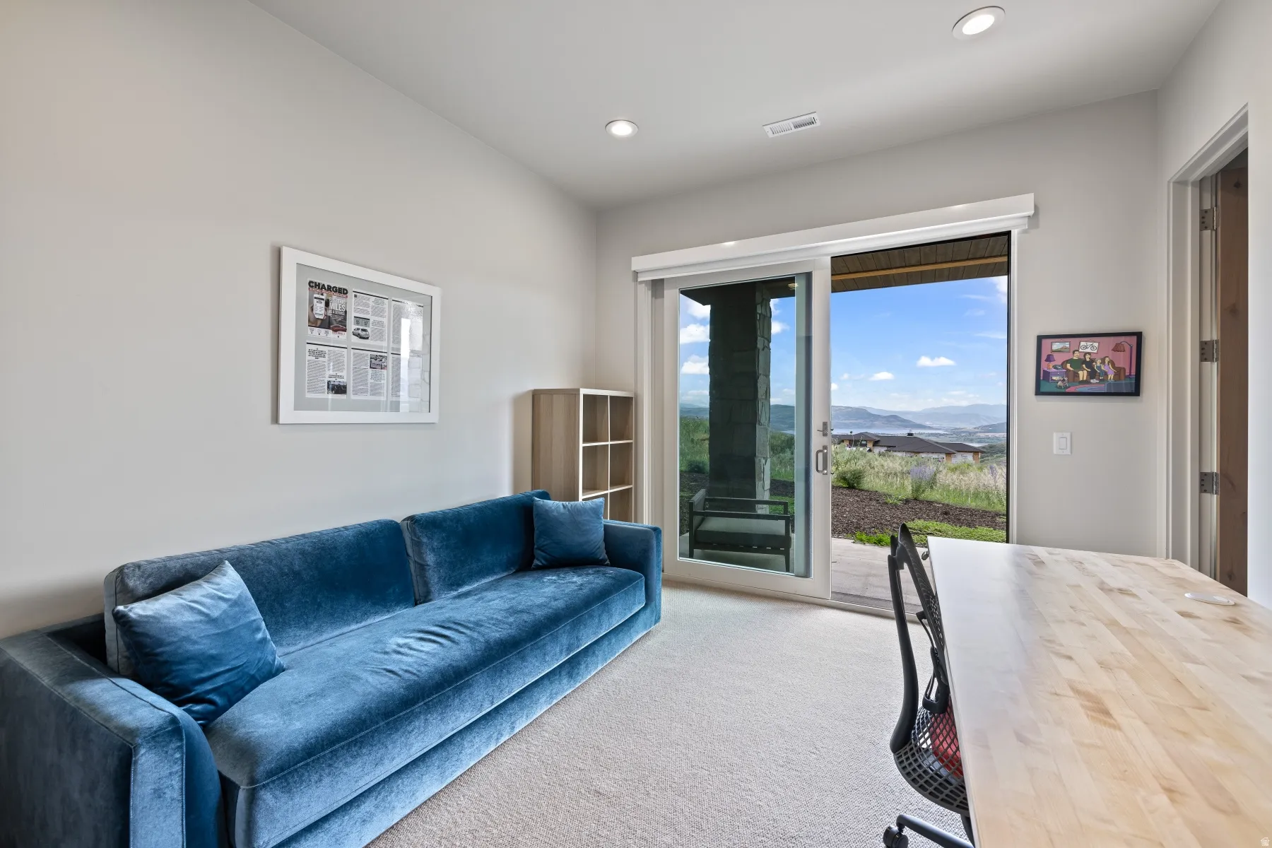 Carpeted living area featuring a mountain view and recessed lighting