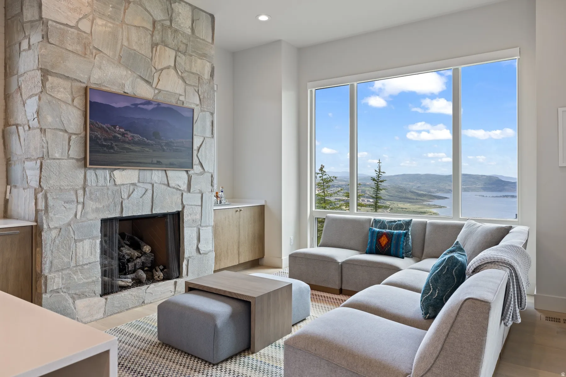 Living area with a fireplace, wood finished floors, and recessed lighting
