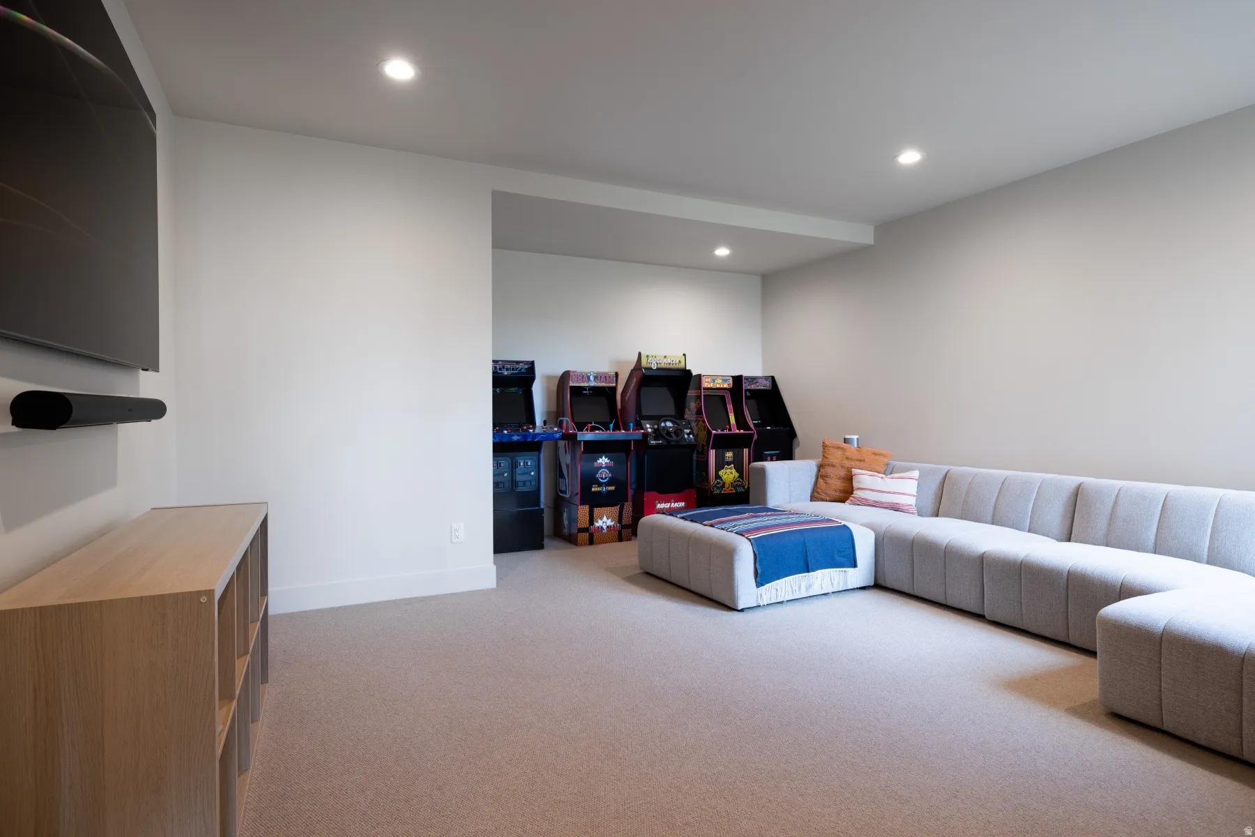 Living area featuring light carpet and recessed lighting