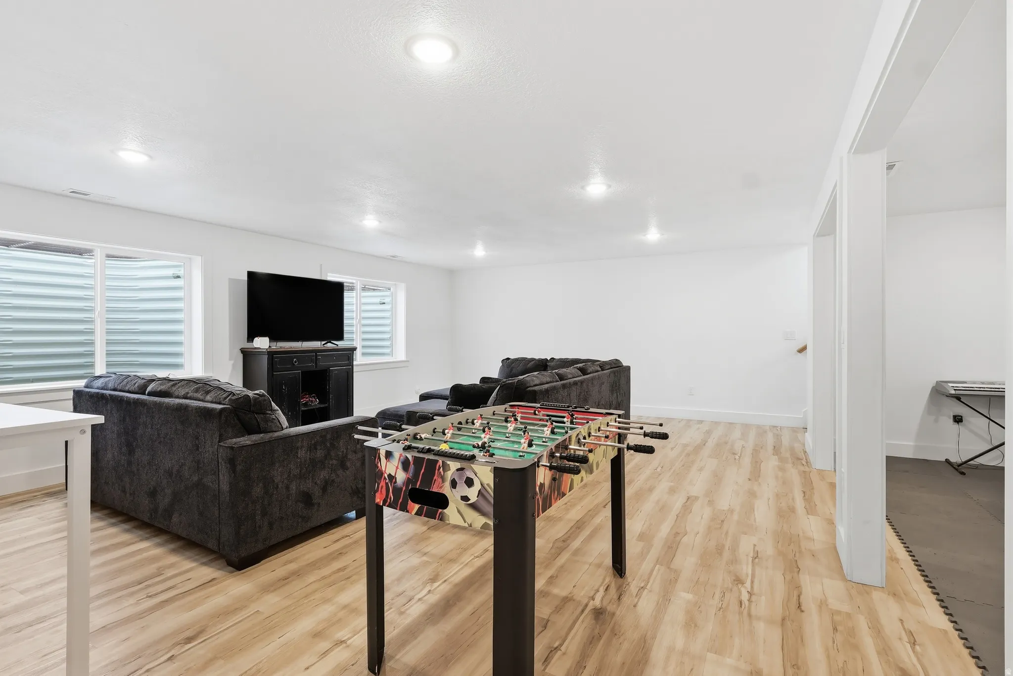 Playroom featuring light wood-style floors and recessed lighting