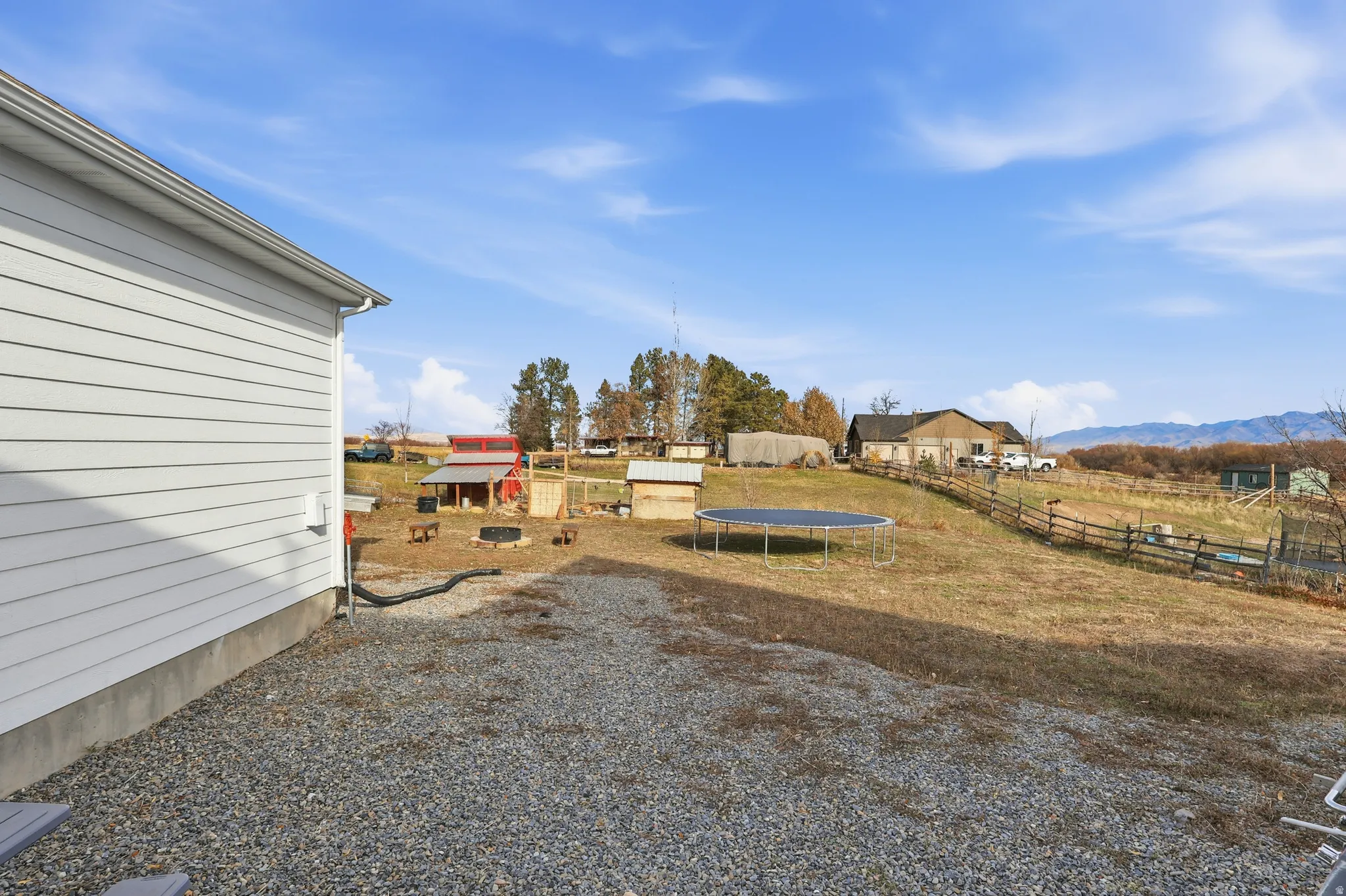 View of yard with a trampoline and a view of countryside