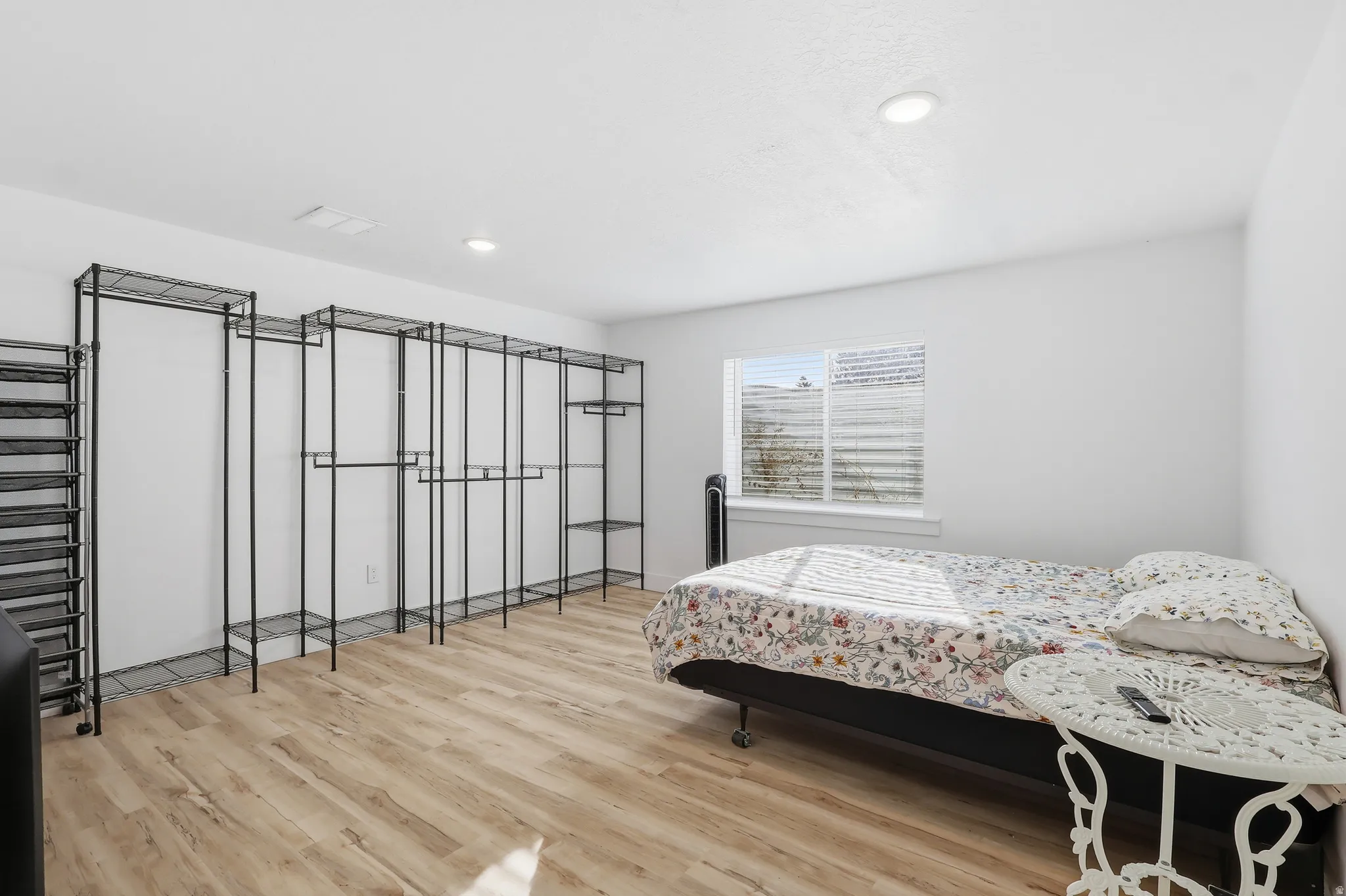 Bedroom featuring light wood-type flooring and recessed lighting