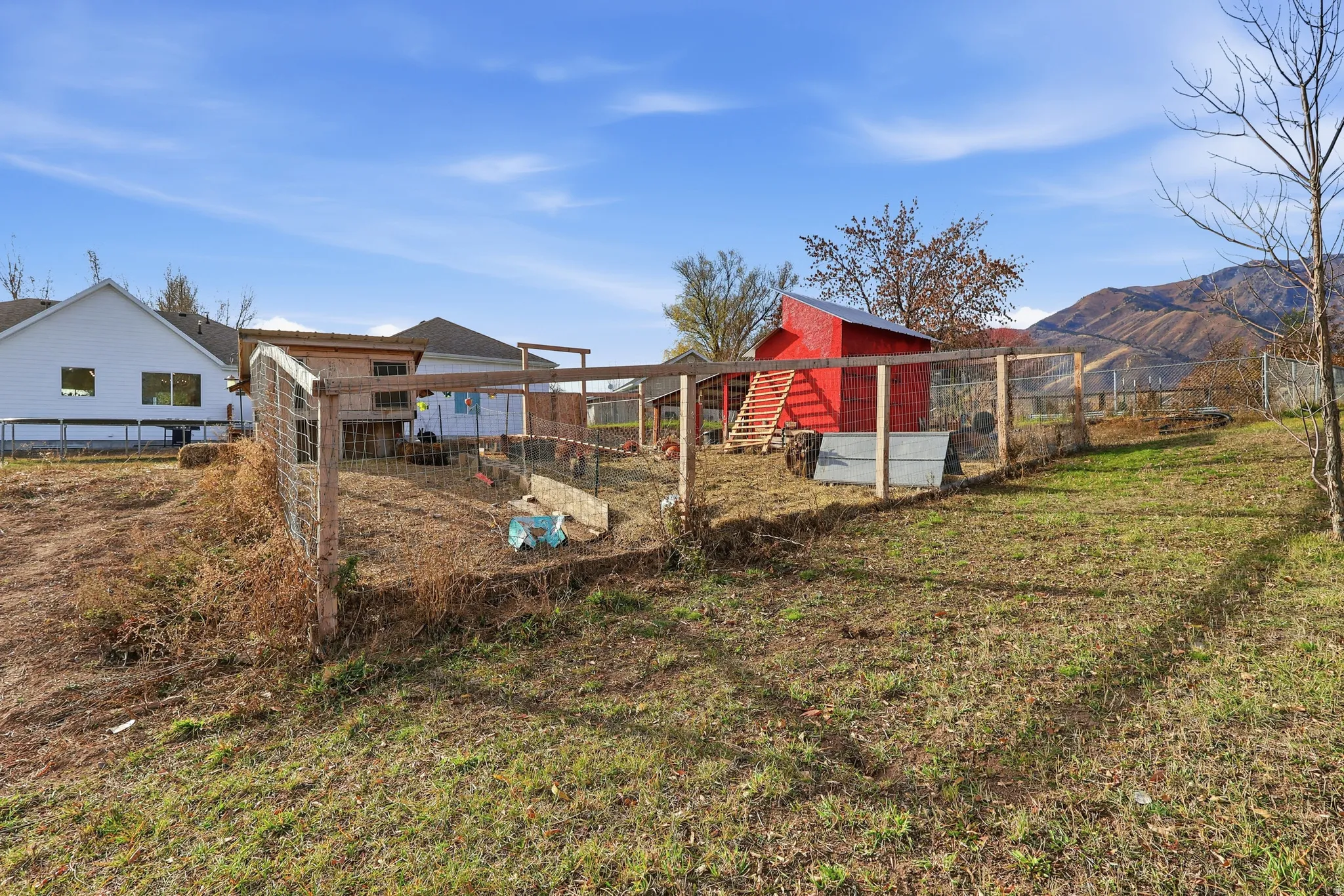 View of yard featuring exterior structure, an outbuilding, and a mountain view
