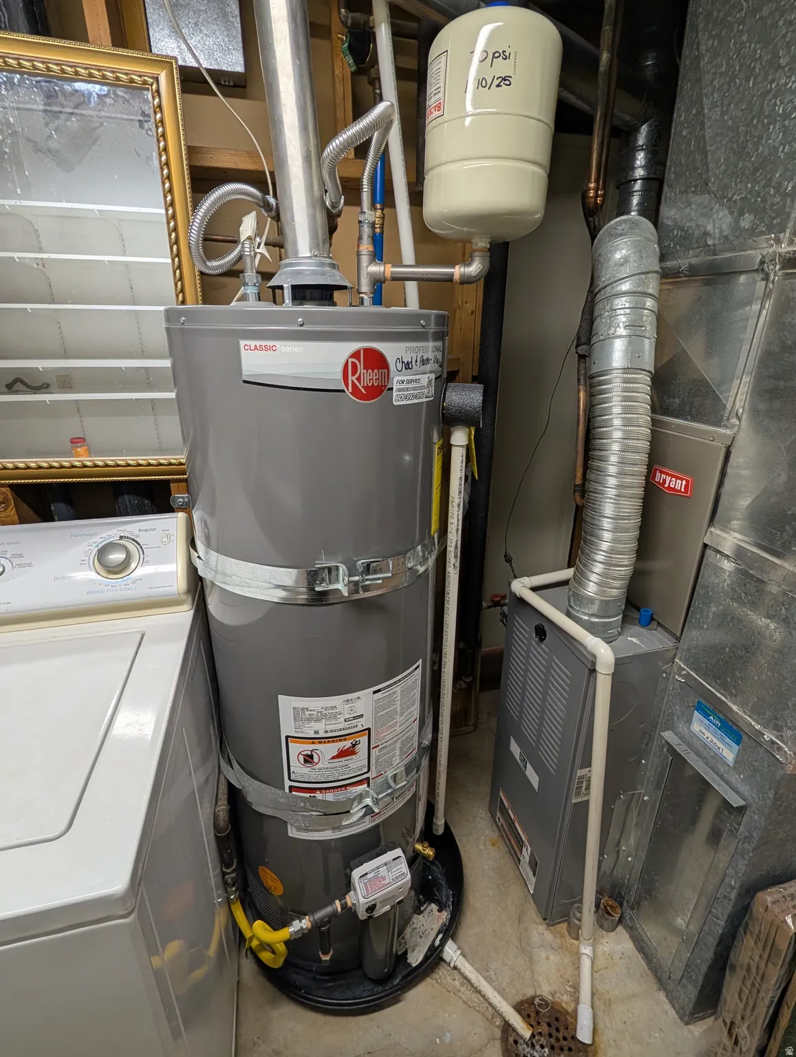 Utility area featuring a water heater, expansion tank, and furnace
